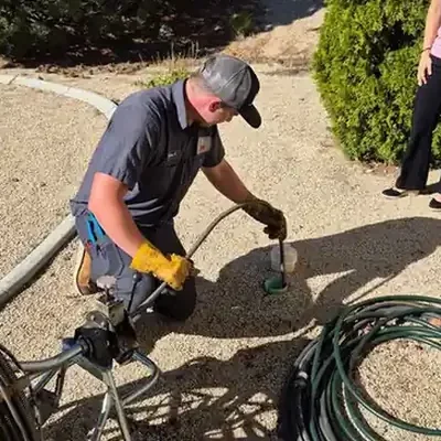 Tech cleaning sewer line 3