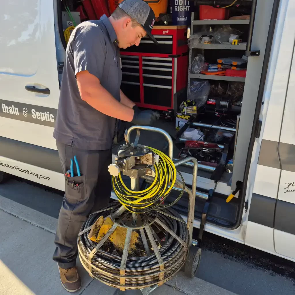 Tech getting equipment to clean the sewer line